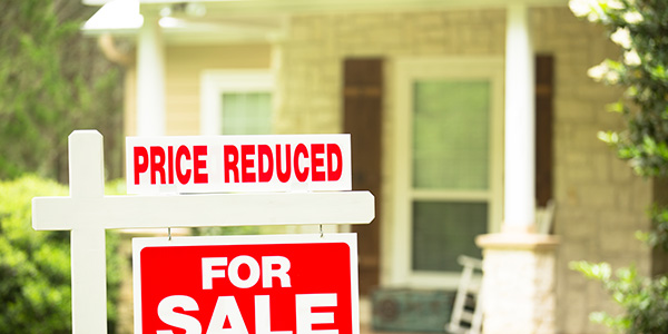 A price reduced home for sale sign