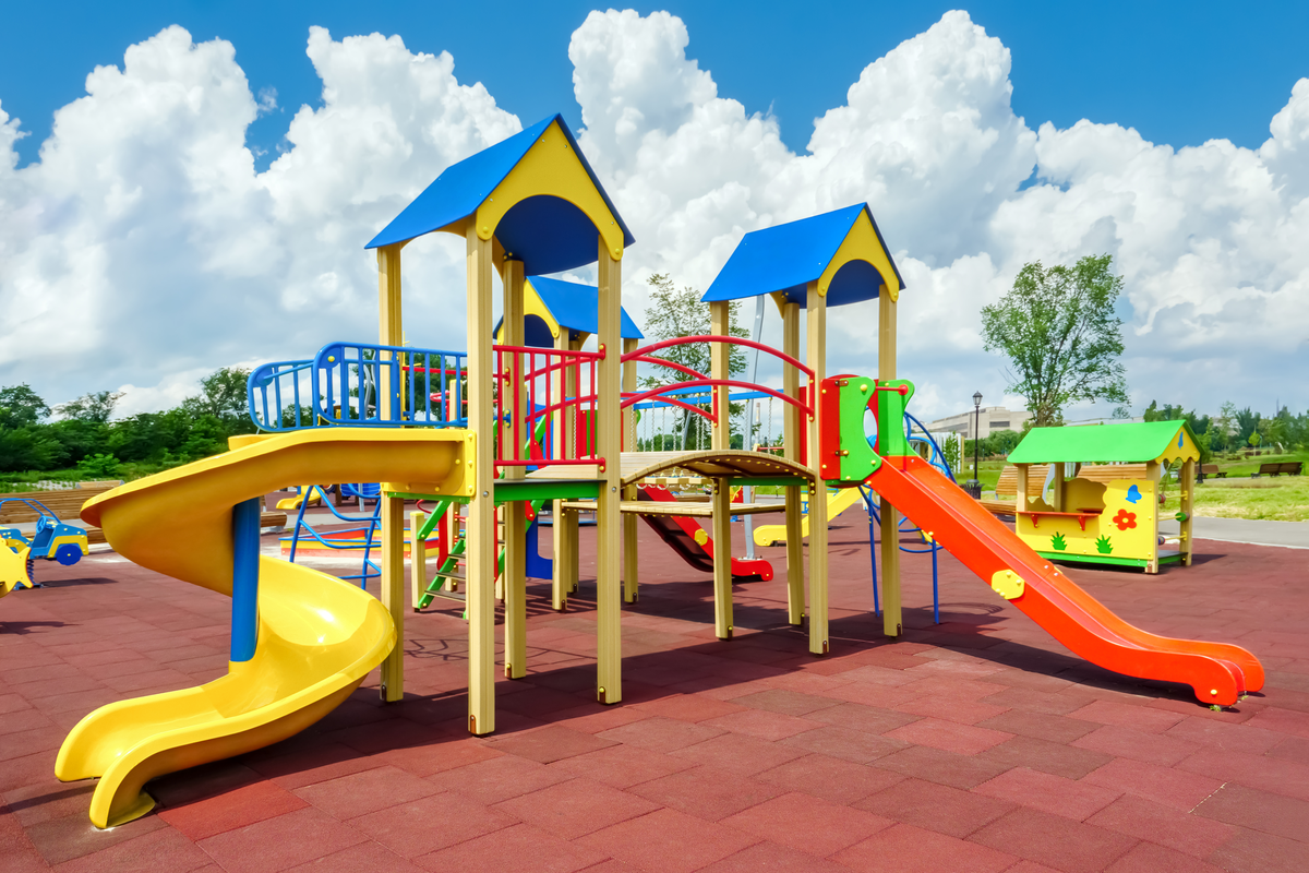 tot lot with a play structure and slides