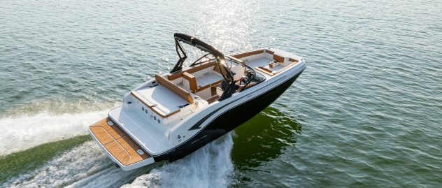 Aerial photo of speeding powerboat fitted with Lenco trim tabs