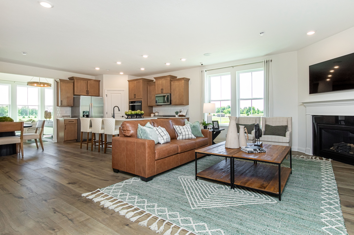 great room with fireplace and hardwood floors 