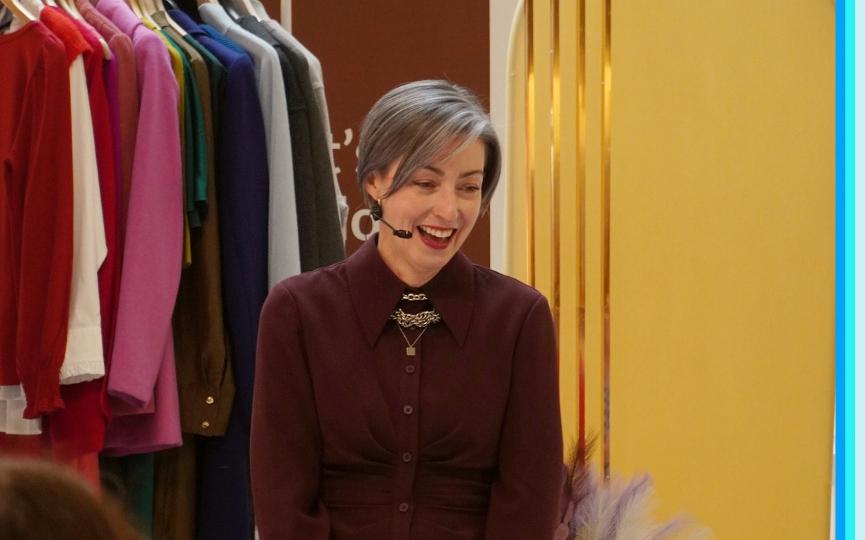 image of Canberra Centre stylist Fiona Keery in front of a rack of clothing 