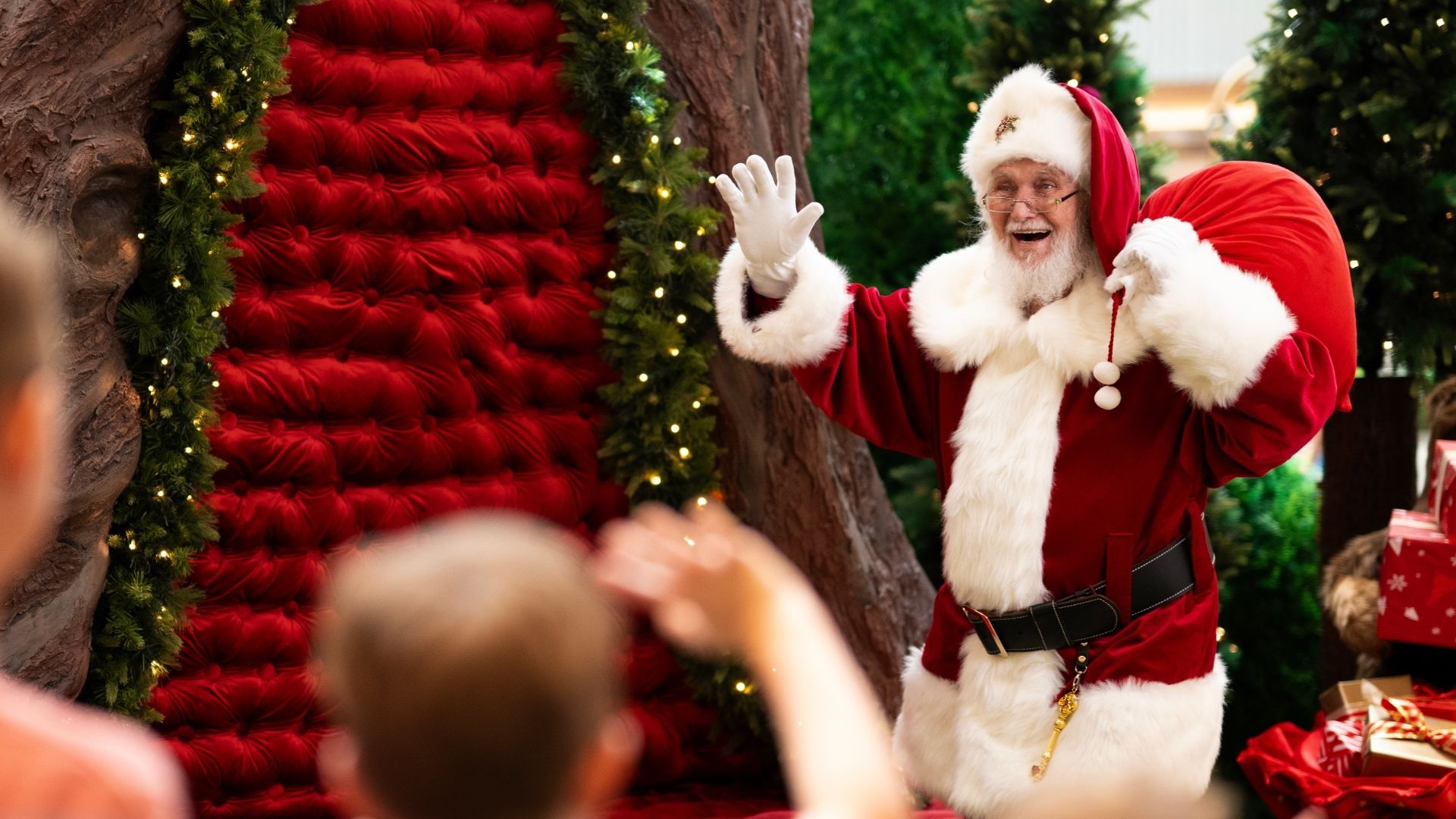 Santa waving to kids