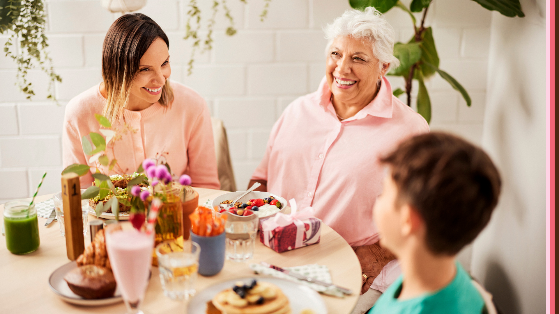 Mum, grandma and son laughing and enjoying Mothers Day brunch together