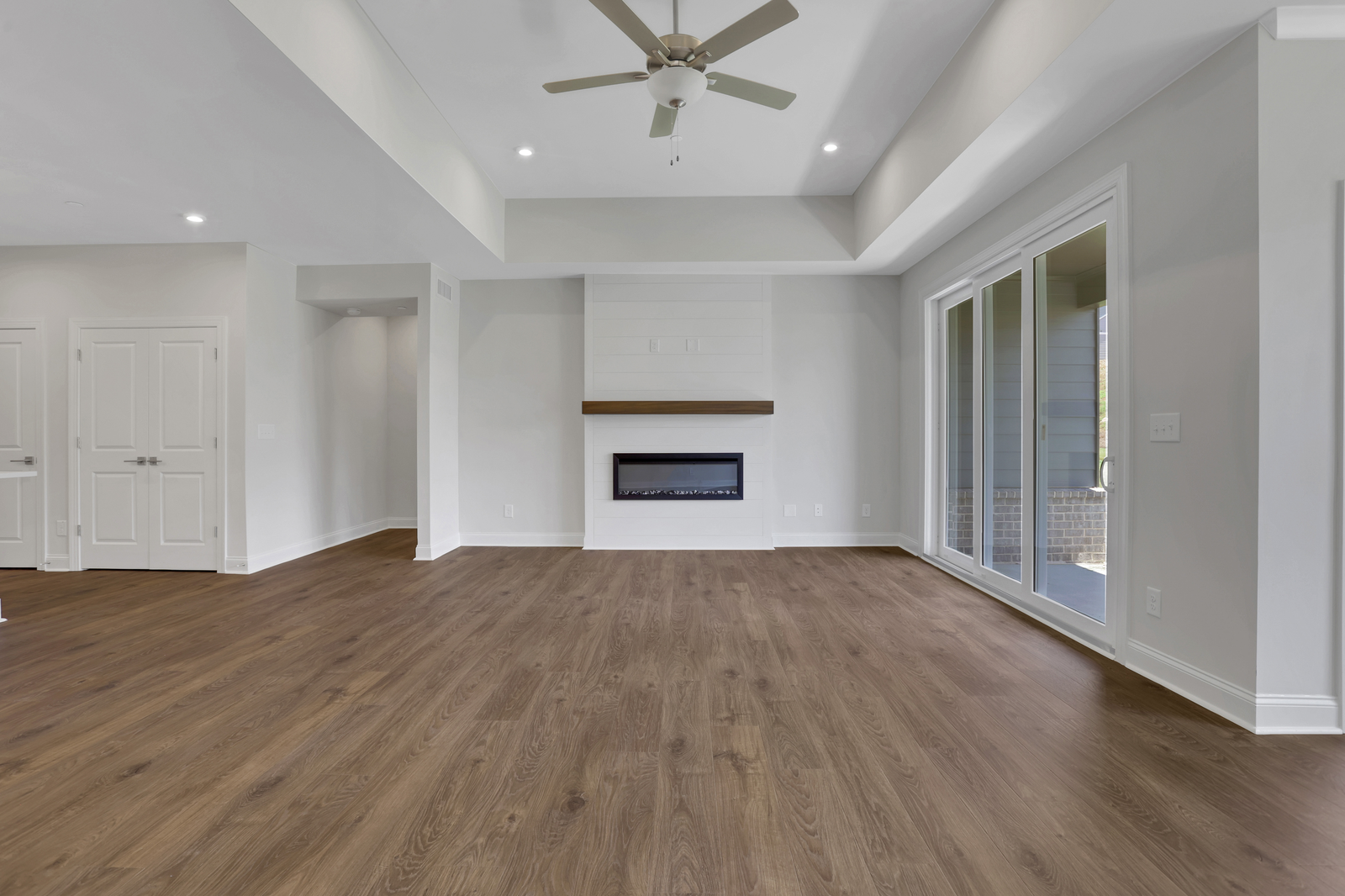 great room with electric fireplace and hard surface flooring