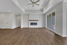 great room with electric fireplace and hard surface flooring