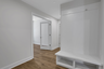 mud room with hard surface flooring and valet