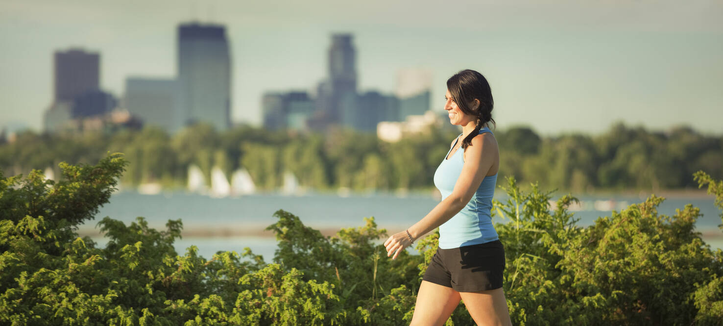 Women power walking in park 