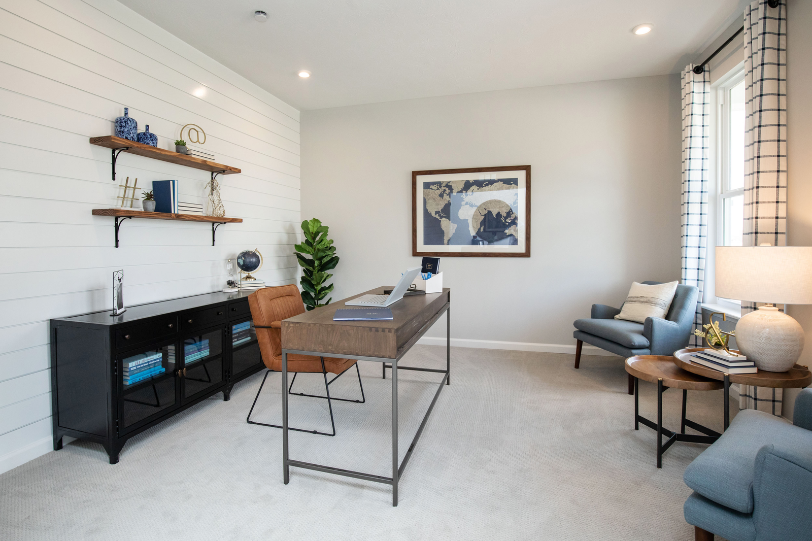 study on main floor with windows and desk 