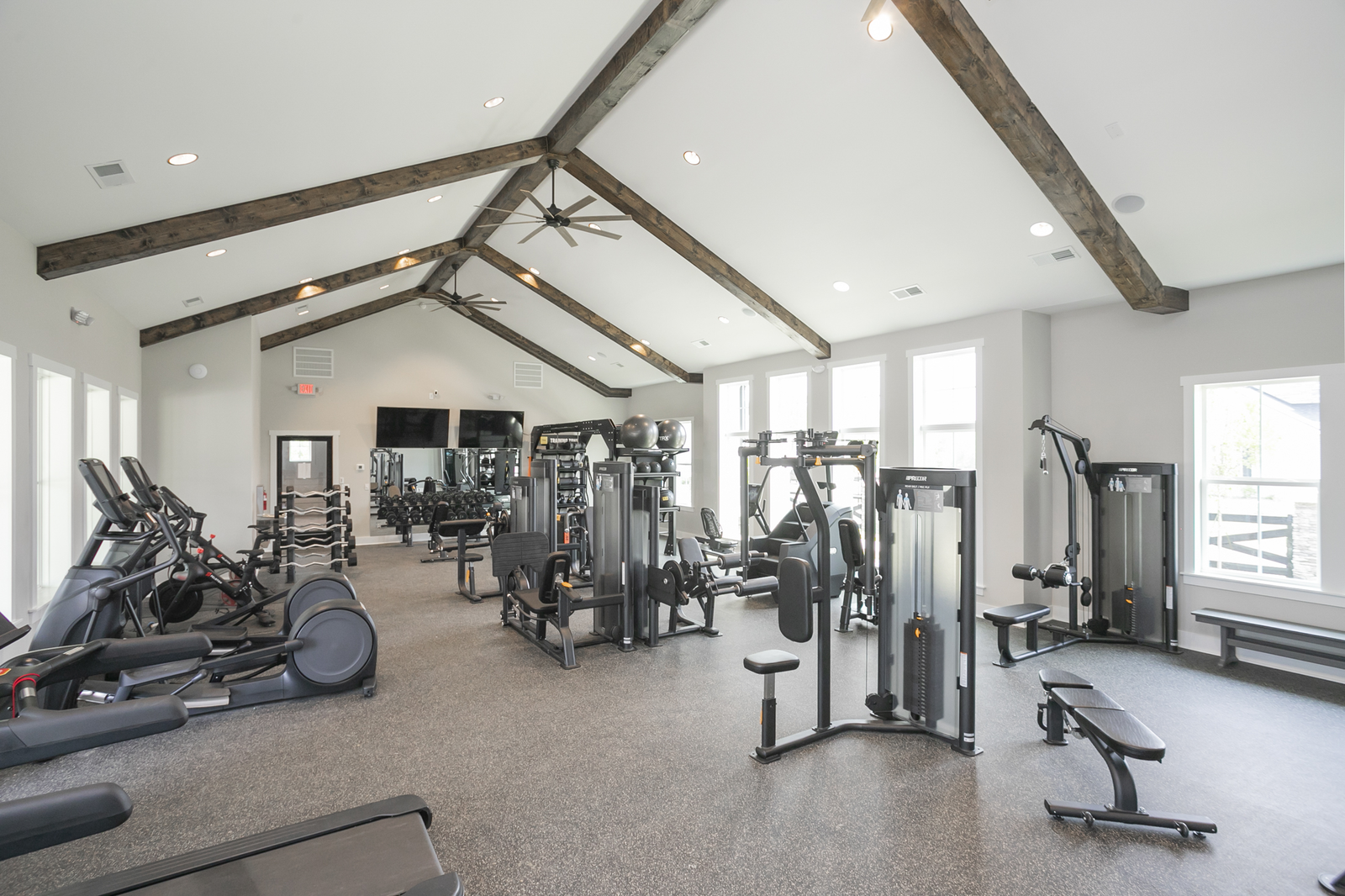 equipment room with workout machines and weights