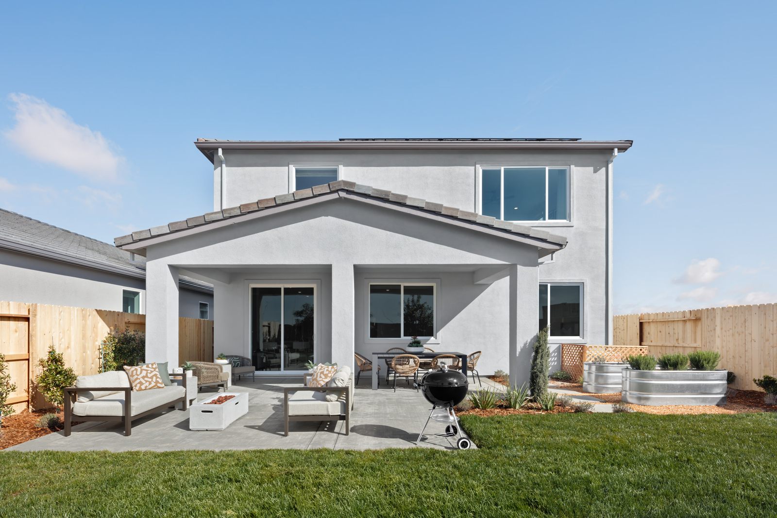 backyard with grass and raised garden beds
