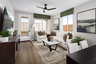 great room with neutral floors and large windows