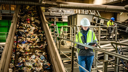 Worker monitoring waste processing in an industrial facility