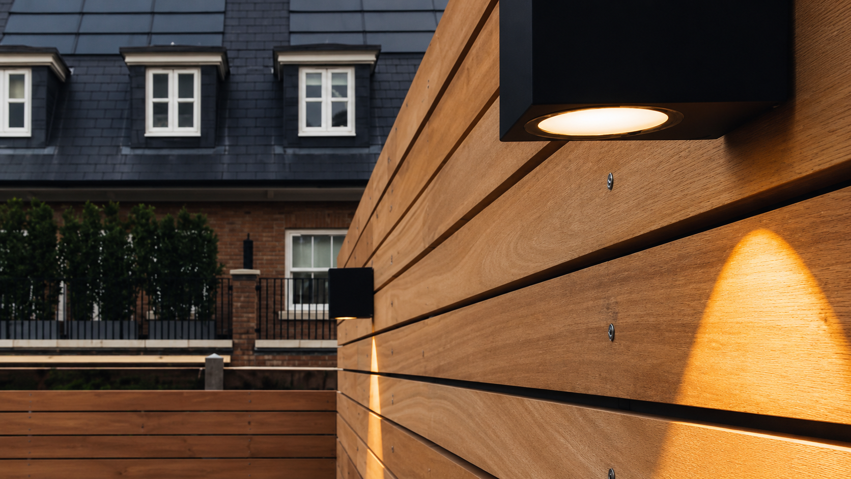 Exterior elevation clad in Yukari hardwood boards running horizontally across the facade