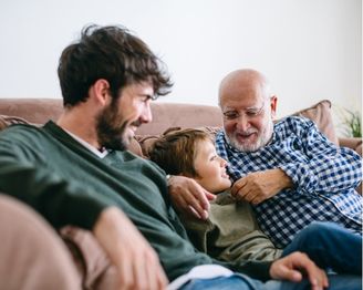 Dad receiving a Father’s Day gift while sharing a meal together