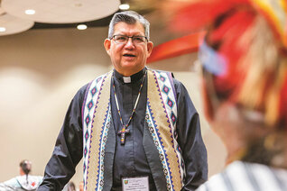 Father Maurice Henry Sands, director of the Black and Indian Mission Office and a longtime member of the Knights of Columbus, speaks to a participant at the 80th annual Tekakwitha Conference, which was hosted in Sharonville, Ohio, July 9. Photo by Matthew Allen