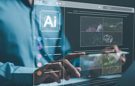 Man using a laptop with an AI program