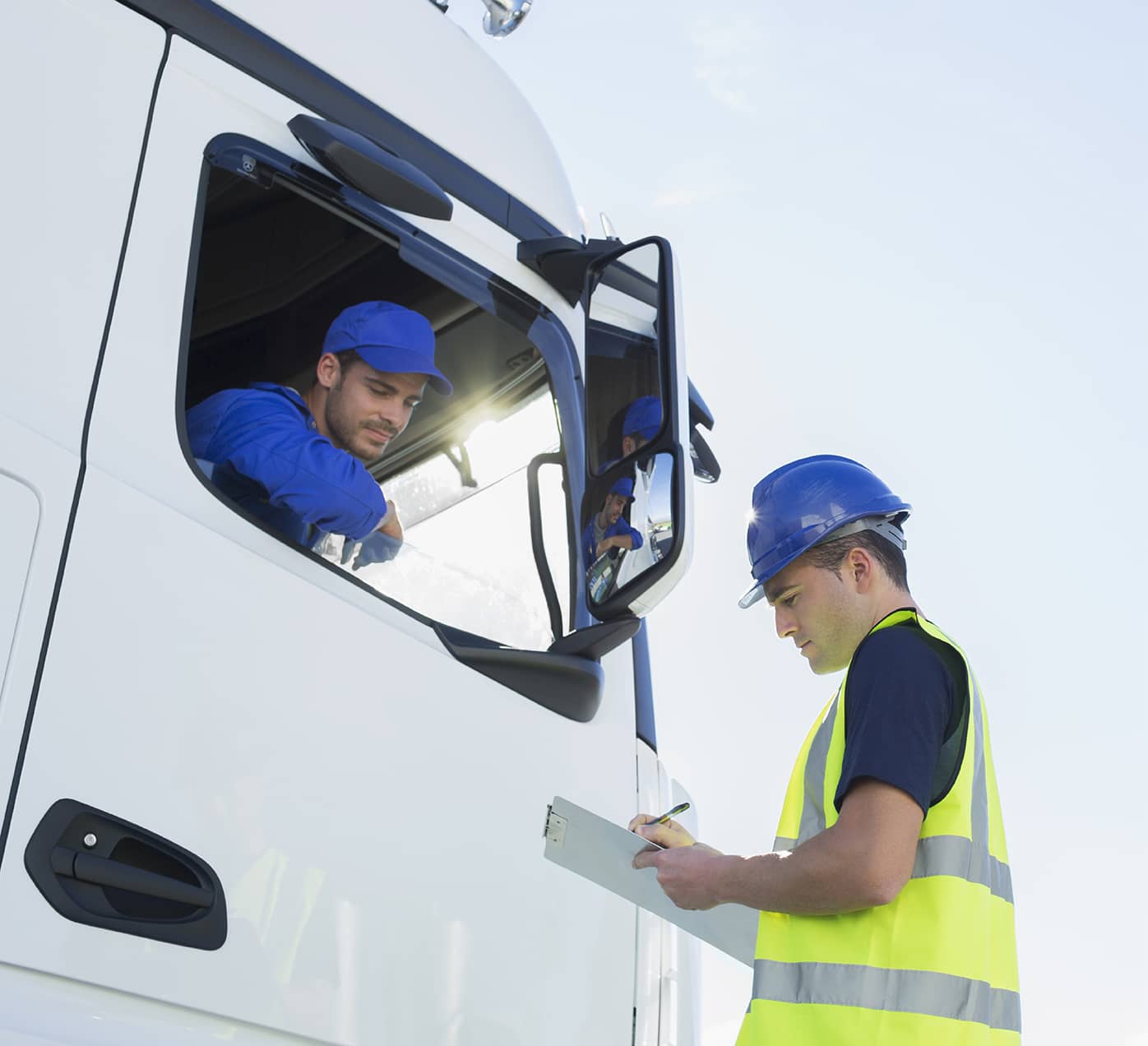 Truck drivers comparing route notes