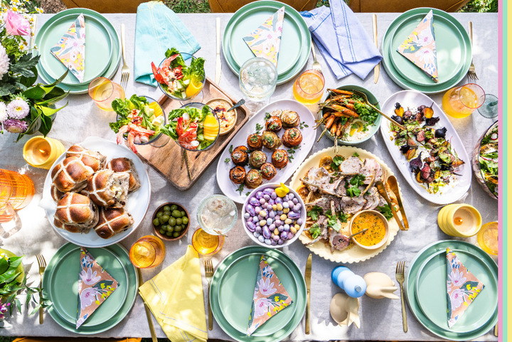 Table scape featuring Easter decor, food and easter eggs