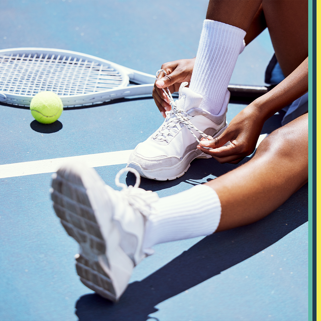 image of tennis shoes and racket