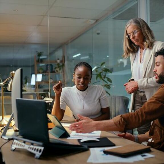 Business people meeting with tablet to review budgets