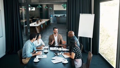 Business People Collaborating in Boardroom