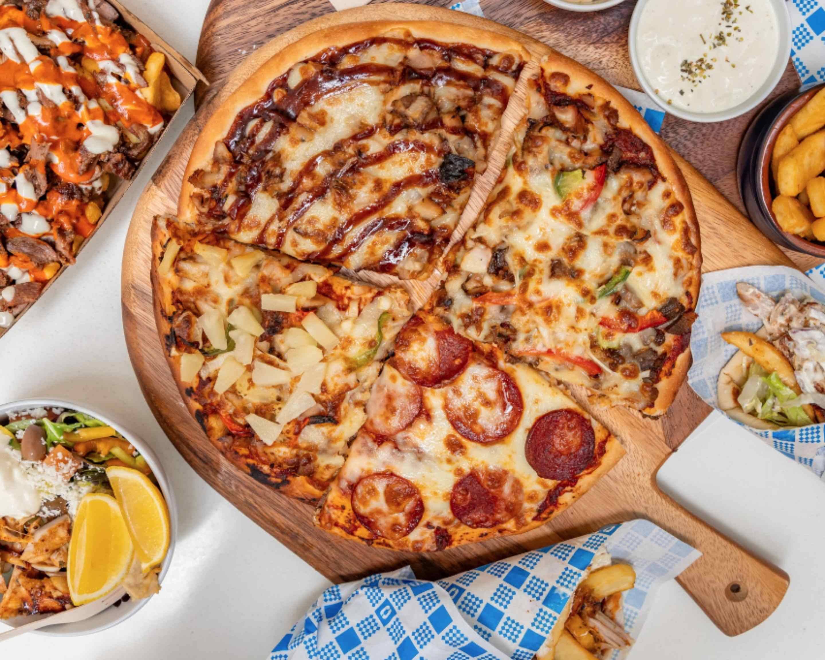 ozi yiros - image of pizza and different foods on the menu
