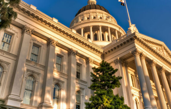 Capitol building lit by sunset 
