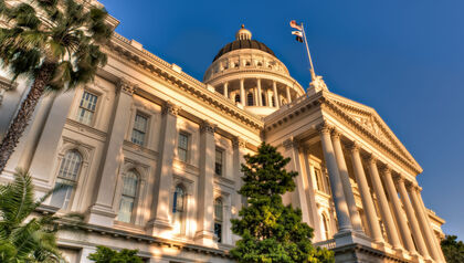 Capitol building lit by sunset 
