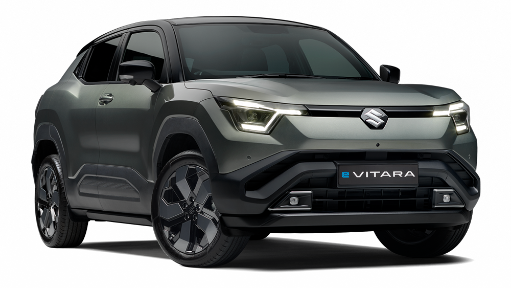 Grey Suzuki e Vitara electric SUV shown in a studio setting with a dark textured background.
