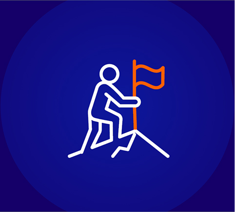 A line icon on a dark blue background showing a person planting an orange flag at the peak of a white, rocky outline of a mountain, symbolizing achievement or setting a goal.