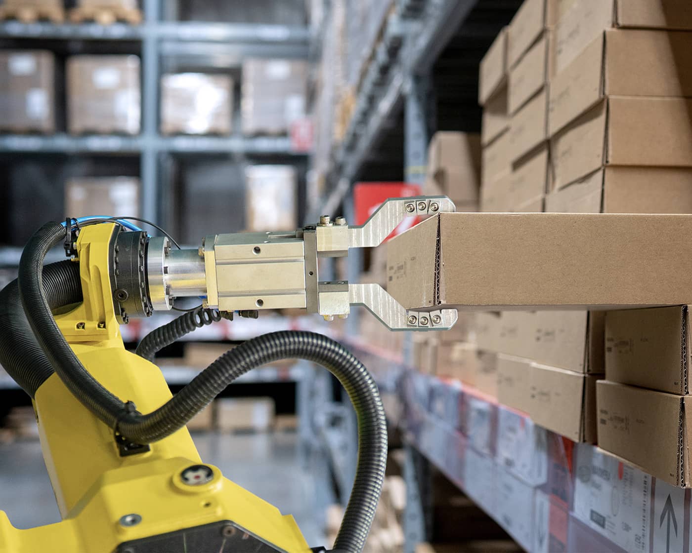 connected-automation-and-robotics.jpg Robot pulling stock from a warehouse shelf