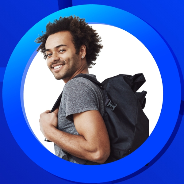 The image is a portrait of a smiling man with curly hair, wearing a grey t-shirt and a dark backpack over his right shoulder. He is looking over his shoulder at the camera.He is framed within a circular graphic. The inner circle is bright white, and it is surrounded by a thick, bright blue ring. The background surrounding the blue ring is a solid, darker blue. The overall appearance suggests a theme of travel, education, or a student-related topic, such as the cost of studying.