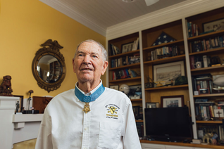Retired Col. Marm wears the Medal of Honor in his home in Fremont, N.C.