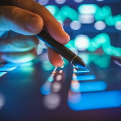 User writing on futuristic tablet