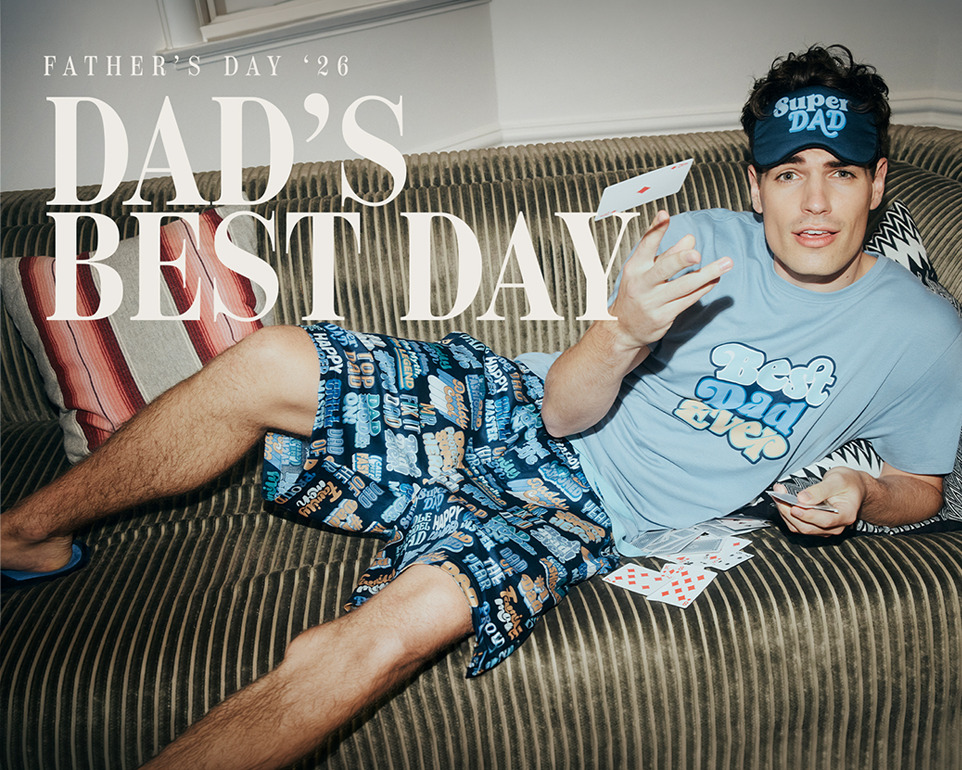 man lying on couch in Peter Alexander Father's Day pyjamas