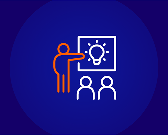 An icon depicting a person (outline in orange) pointing to a screen with a lightbulb idea symbol (white outline) in front of two seated people (white outlines). The background is a solid dark blue circle on a lighter blue background.