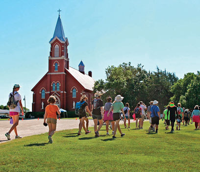 Pilgrims arrive at St. John Nepomucene Catholic Church in Pilsen, the destination of the 60-mile pilgrimage.