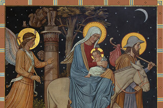 Joseph leading Mary on a donkey with baby Jesus