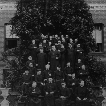 Father McGivney photographed with fellow priests.