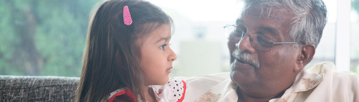 Grandfather looking at child.