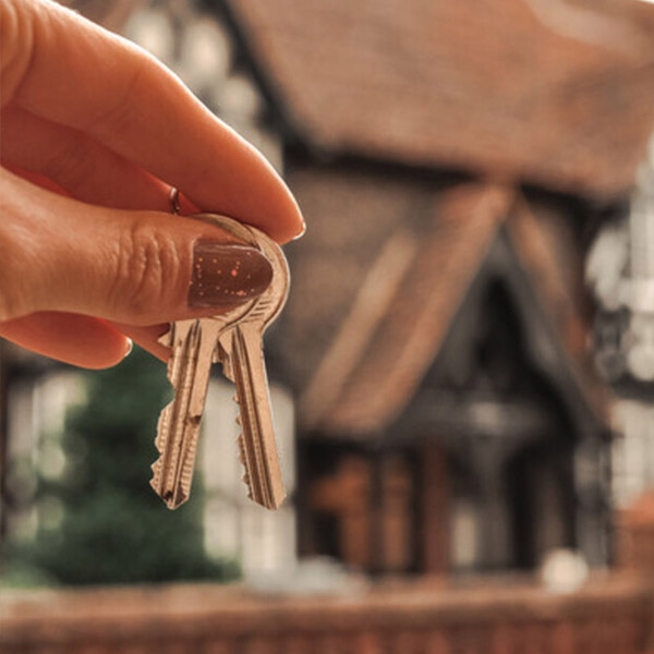 hand holding house keys