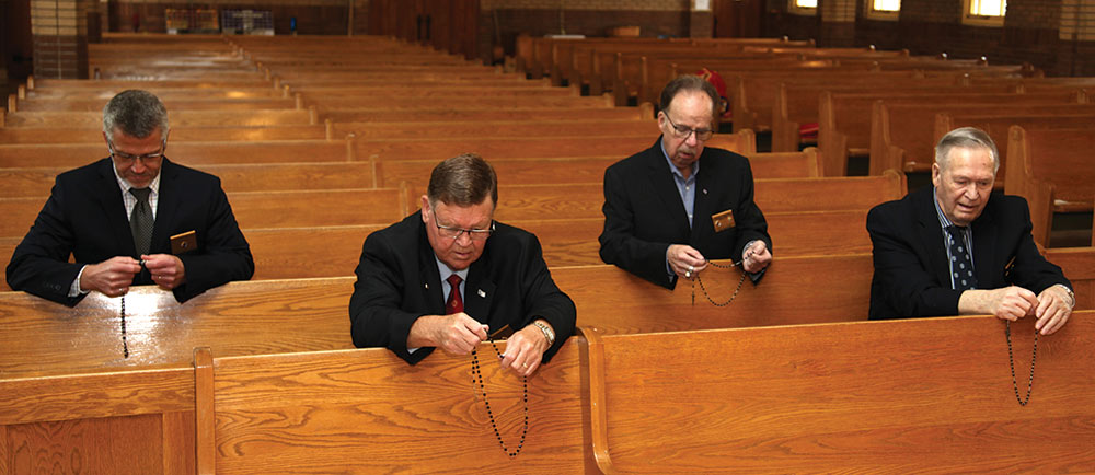 Members of St. Bernard&rsquo;s Council 11625 in Enfield, Nova Scotia, pray a rosary for Tom Bagley at St. Bernard&rsquo;s Church. From left to right: Grand Knight John Steele, Joe MacLean, David Lewis, and Joe Gignac, a retired police officer.