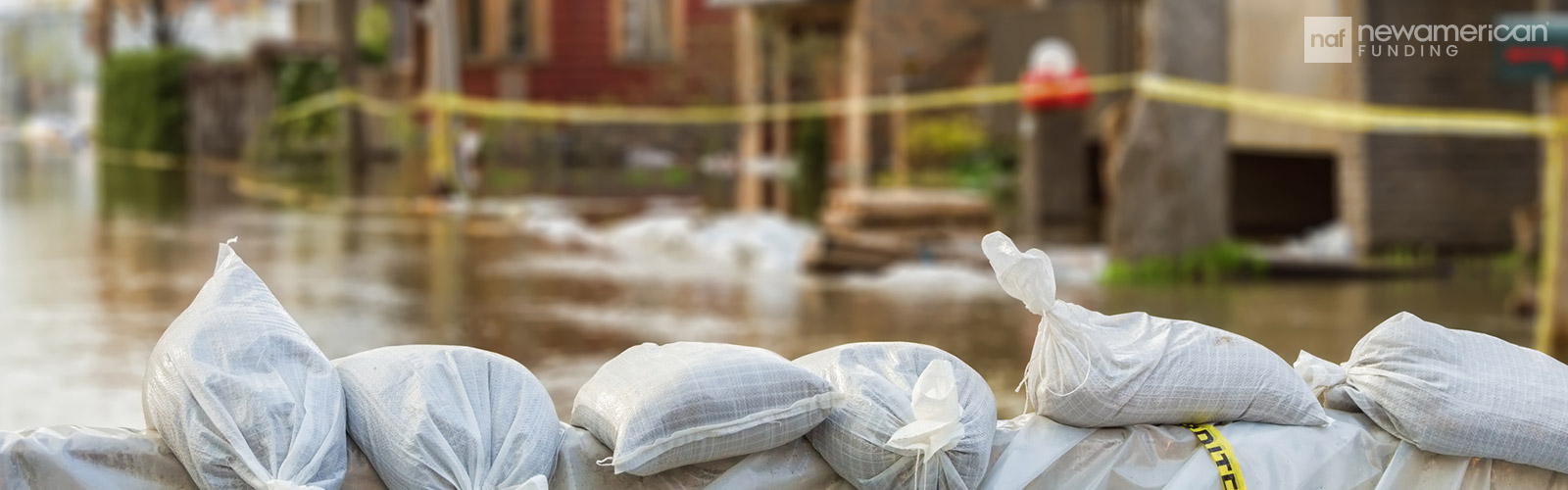 A wall made of sandbags in a flooded area