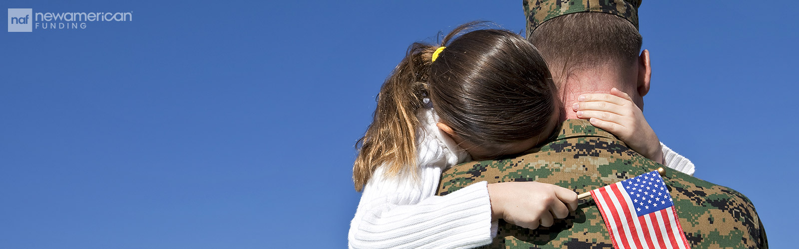 military father holding his daughter