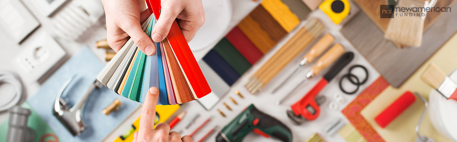 A person choosing a pain swatch