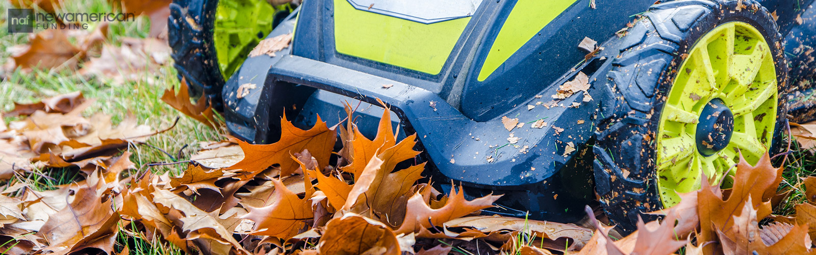 mowing the lawn with fall leaves