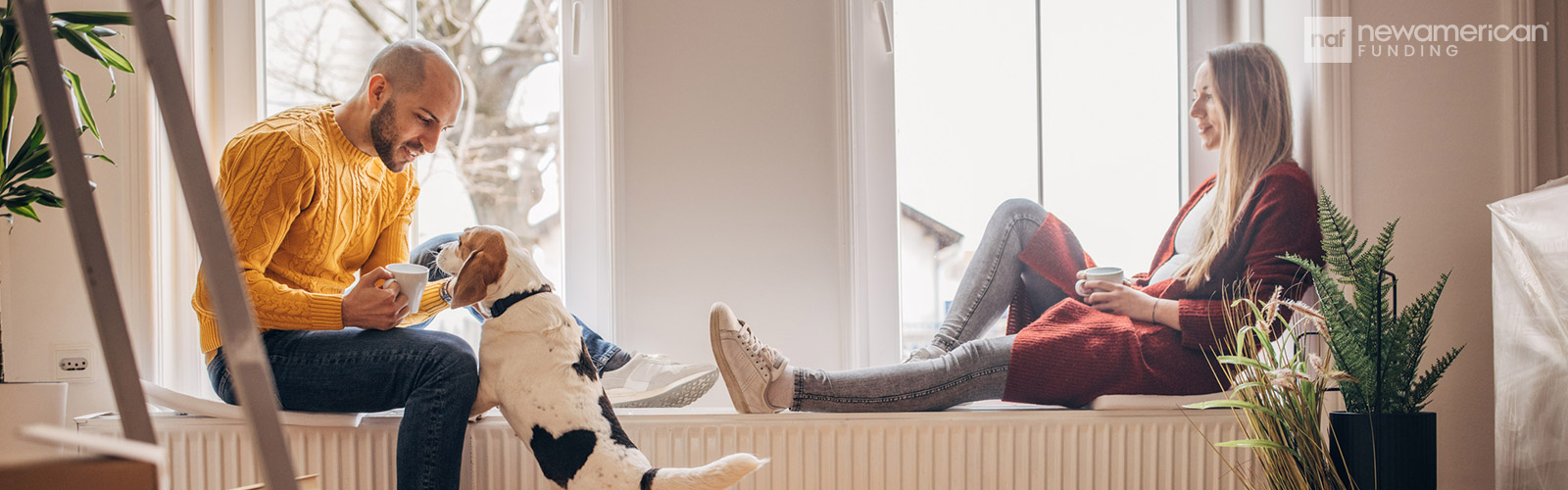 couple in their new home with their dog