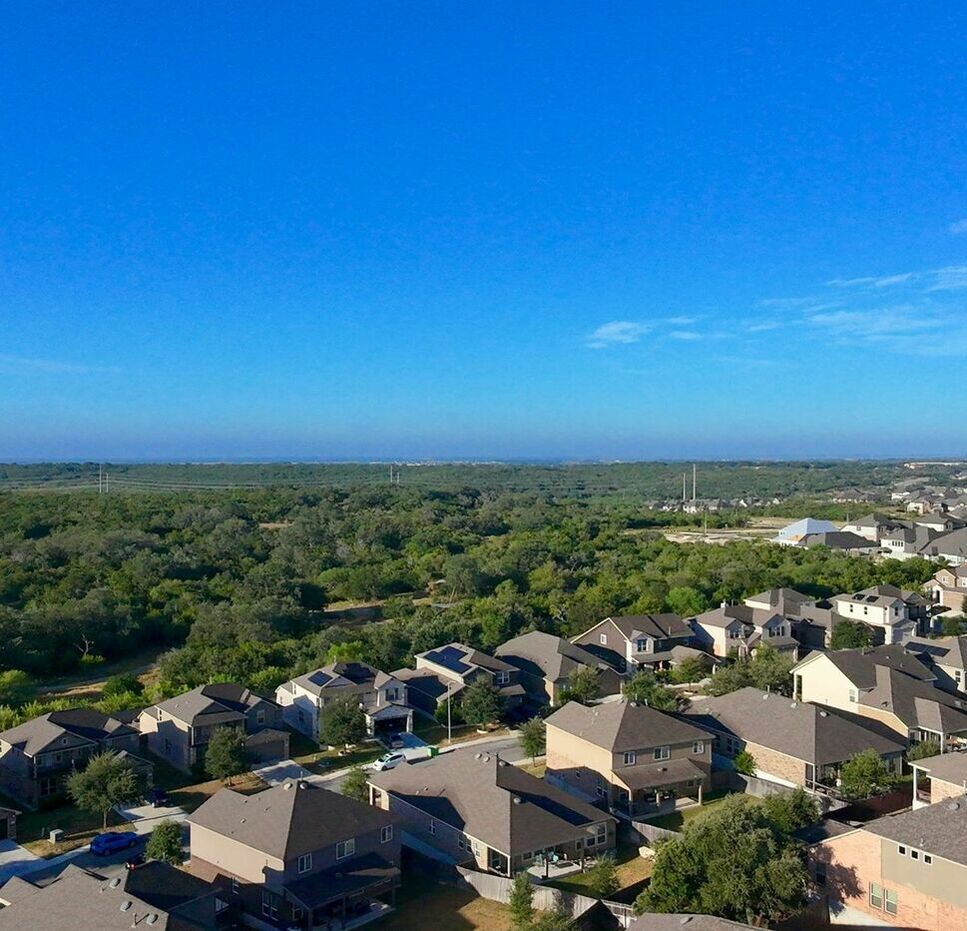 Aerial view of suburban houses representing housing availability