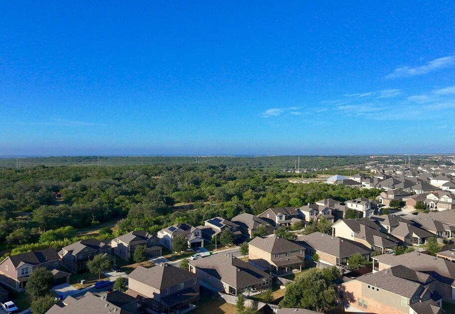 Aerial view of suburban houses representing housing availability