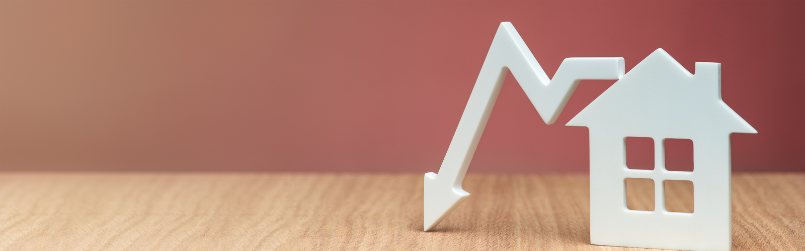 A model home with an arrow pointing down